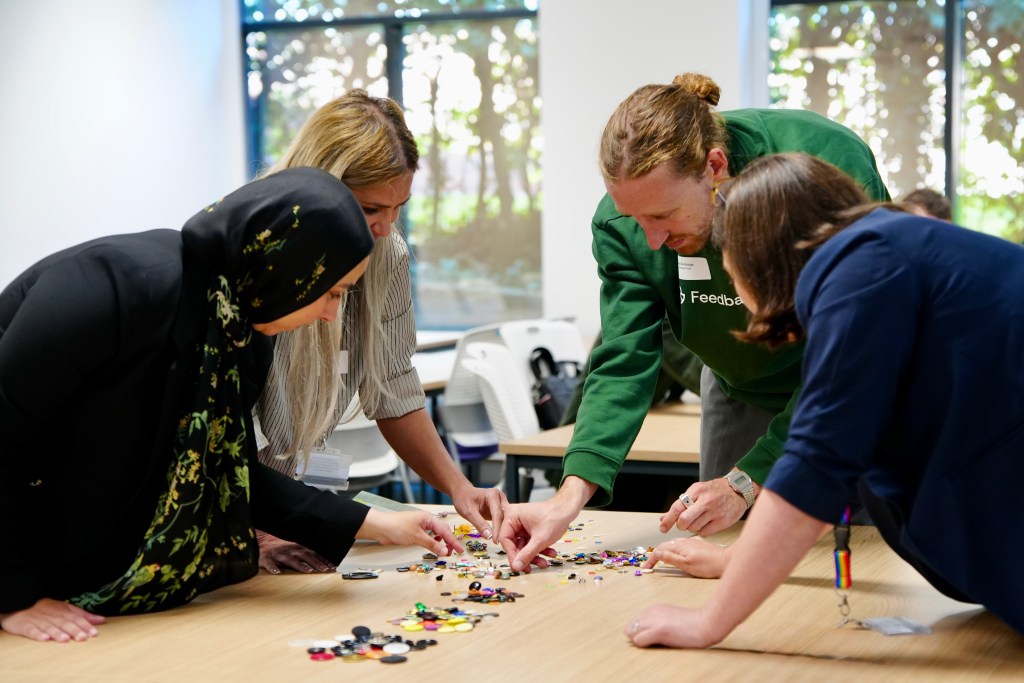 Image of conference participants in a Lego activity